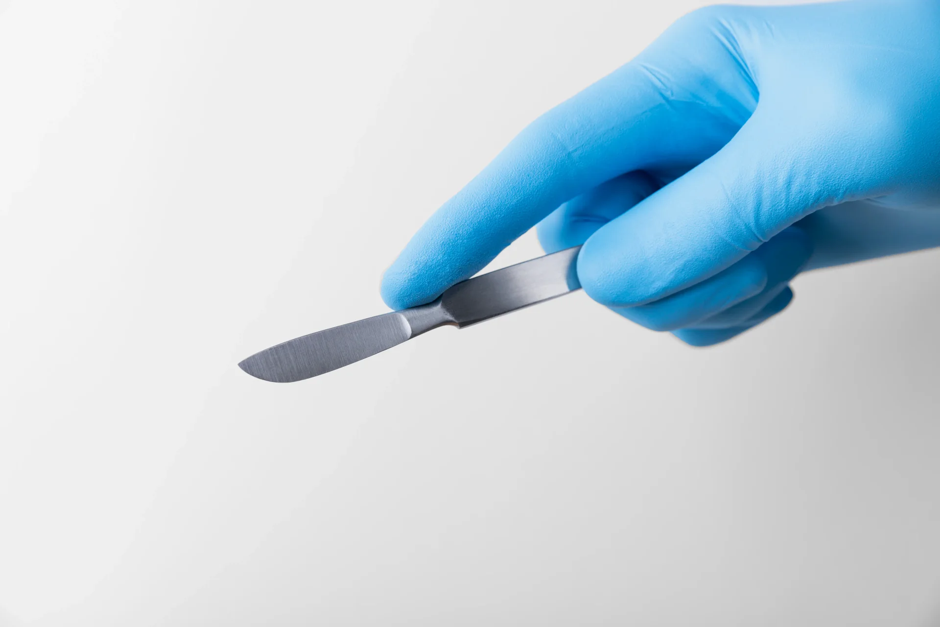 Hand holding scalpel